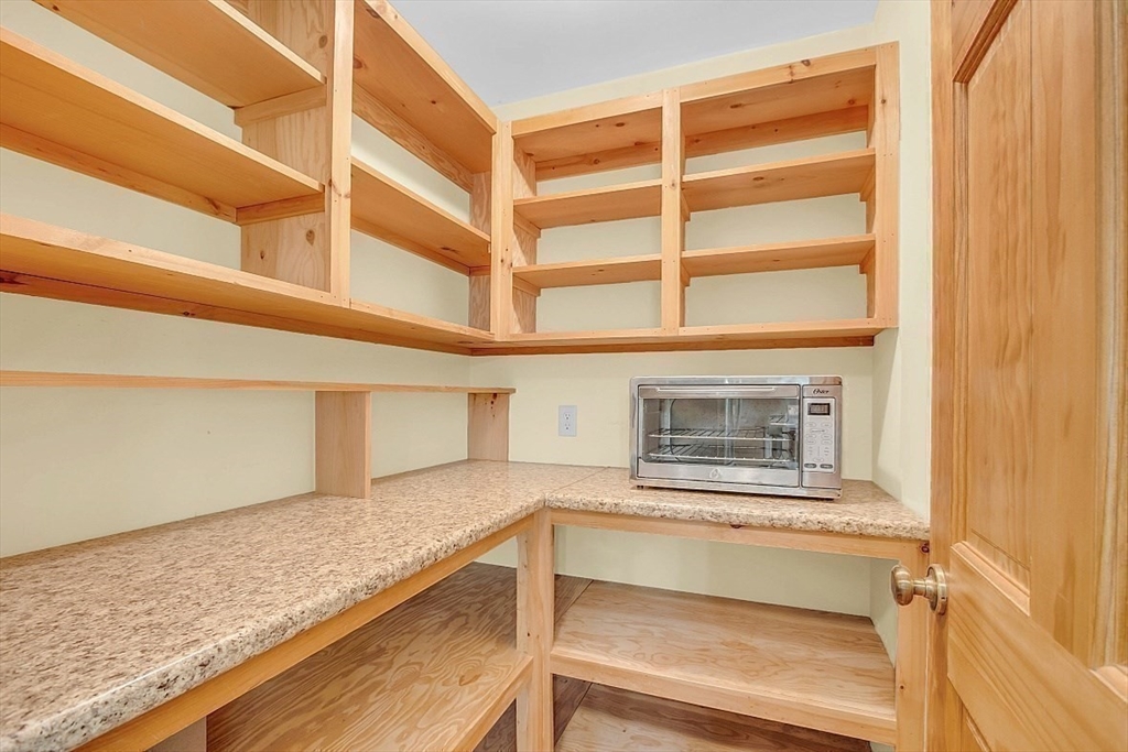 371 Walnut Hill Road Orange, MA 01364 - Photo 14 of 41 a view of an empty room with kitchen and wooden floor