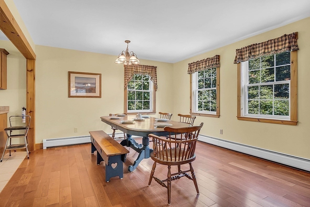 371 Walnut Hill Road Orange, MA 01364 - Photo 16 of 41 a view of a dining room with furniture window and wooden floor