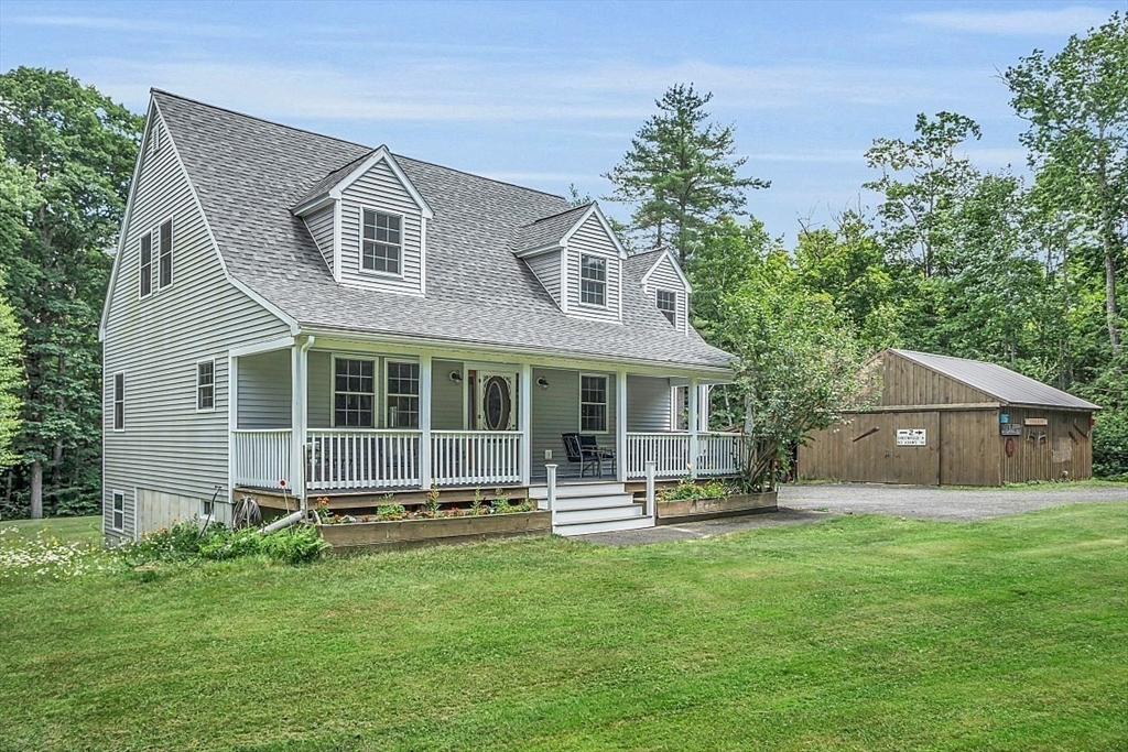 371 Walnut Hill Road Orange, MA 01364 - Photo 2 of 41 a front view of a house with a yard and green space