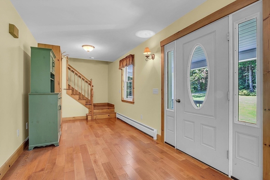 371 Walnut Hill Road Orange, MA 01364 - Photo 22 of 41 a view of entryway with wooden floor and stairs
