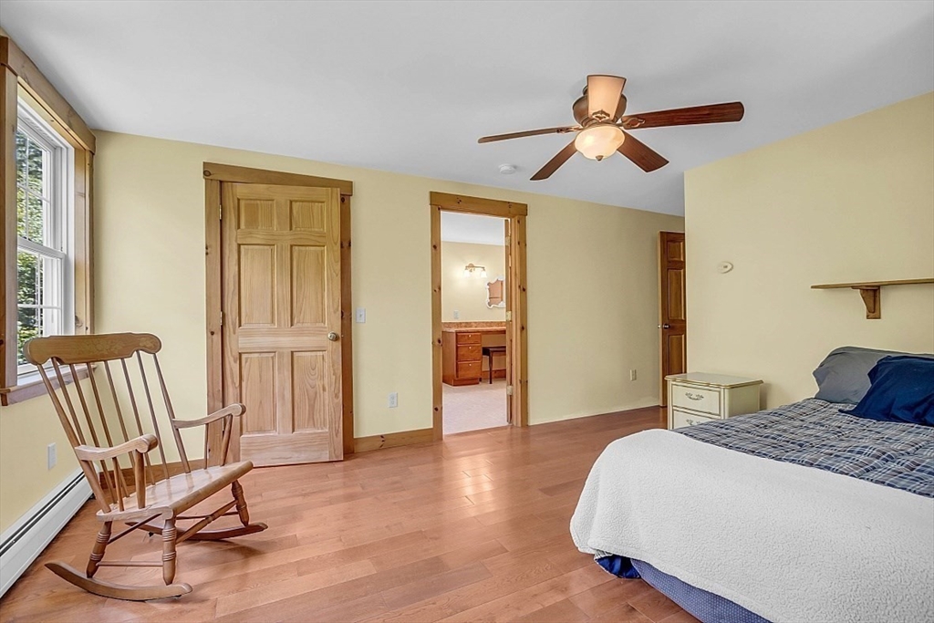 371 Walnut Hill Road Orange, MA 01364 - Photo 24 of 41 a bedroom with a bed and a chair
