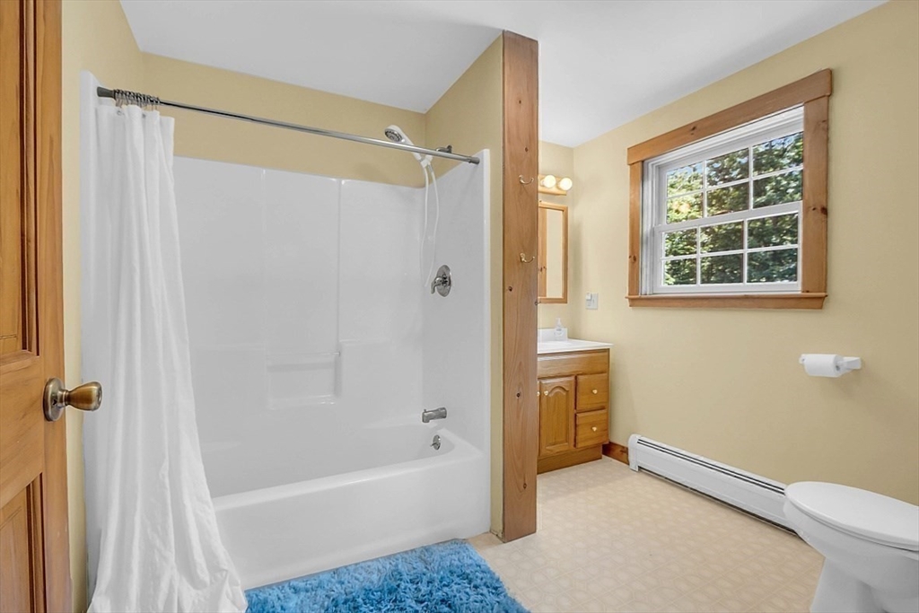 371 Walnut Hill Road Orange, MA 01364 - Photo 30 of 41 a bathroom with a tub shower and a sink