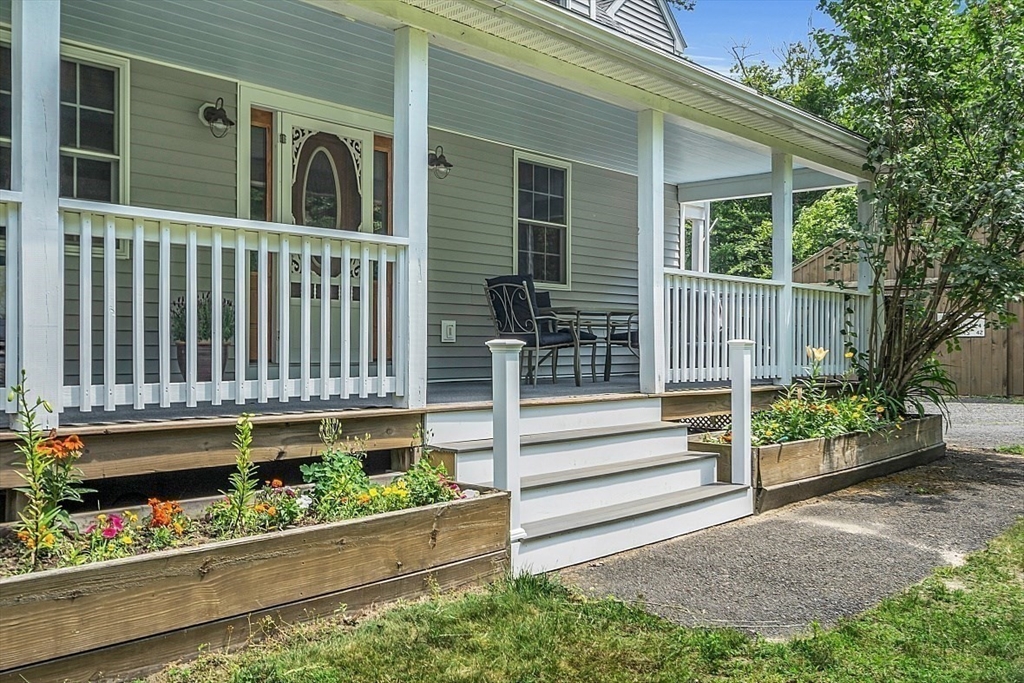 371 Walnut Hill Road Orange, MA 01364 - Photo 3 of 41 a view of a house with a small yard and wooden fence