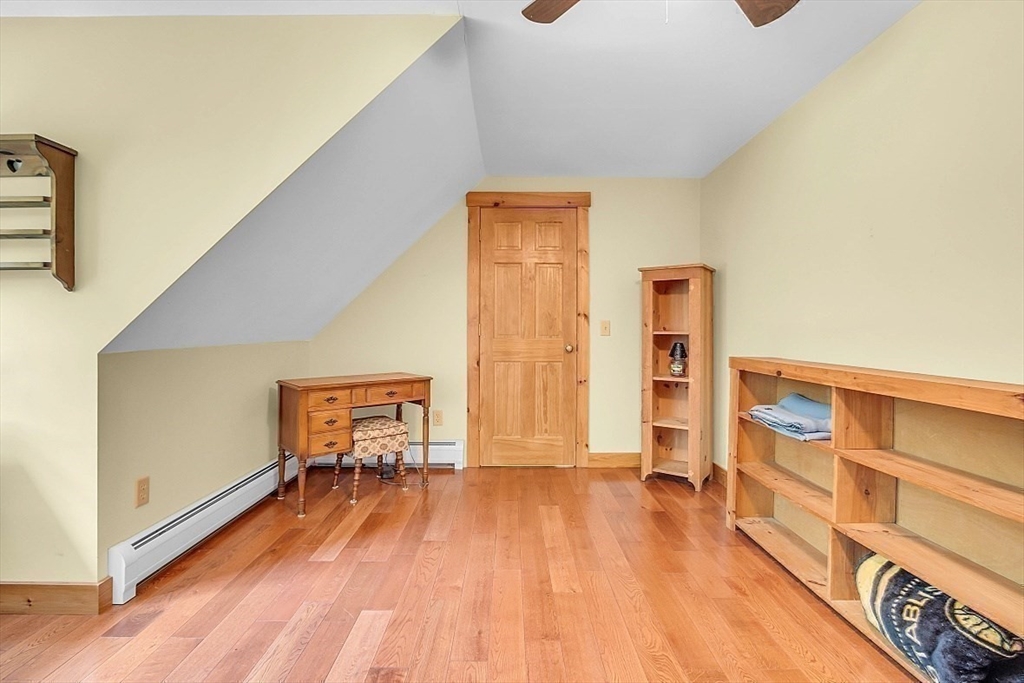 371 Walnut Hill Road Orange, MA 01364 - Photo 31 of 41 a view of an empty room with wooden floor and a window