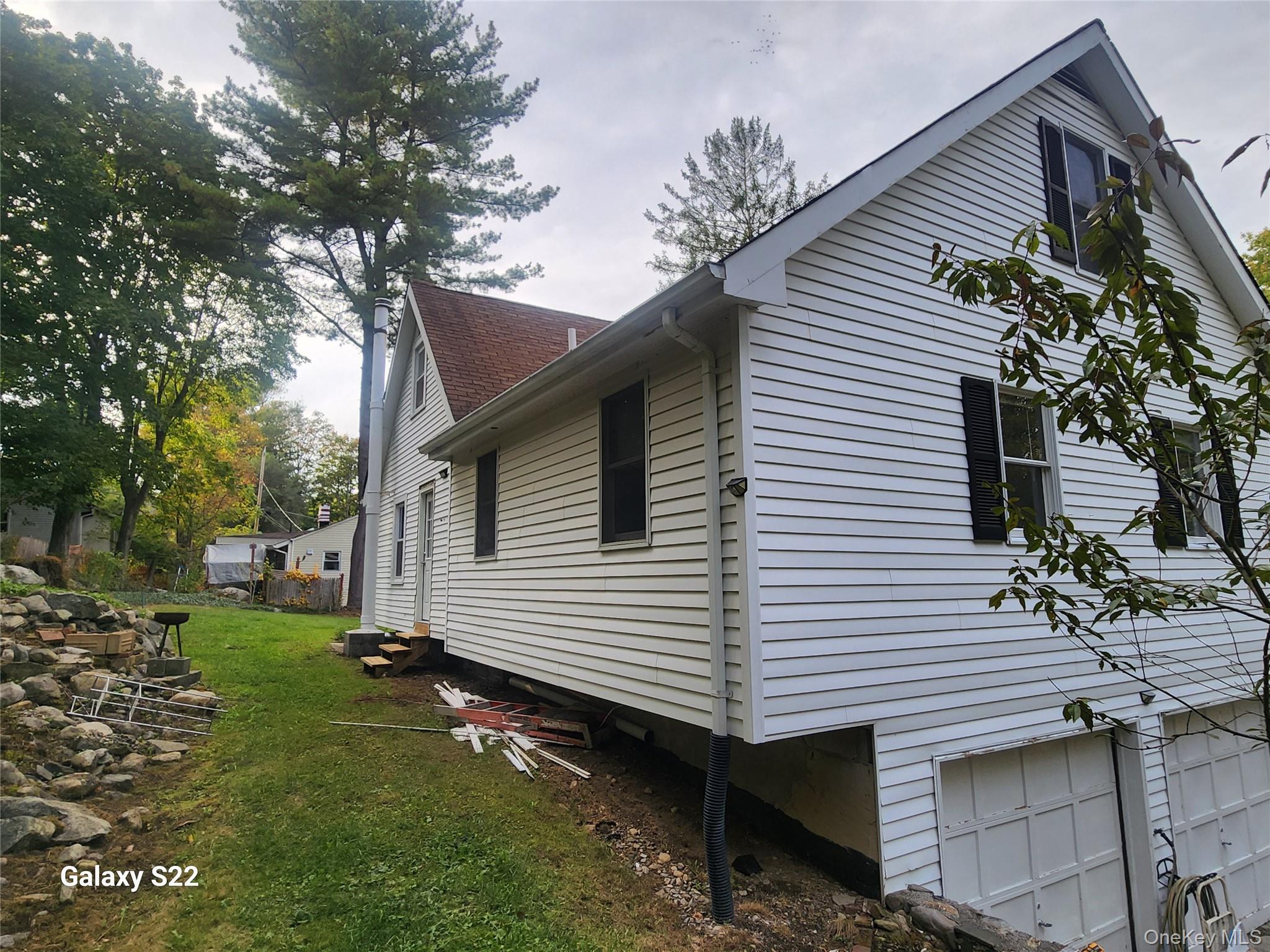 116 Croton Park Road Cortlandt Manor, NY 10567 - Photo 2 of 16 a view of a house with a yard