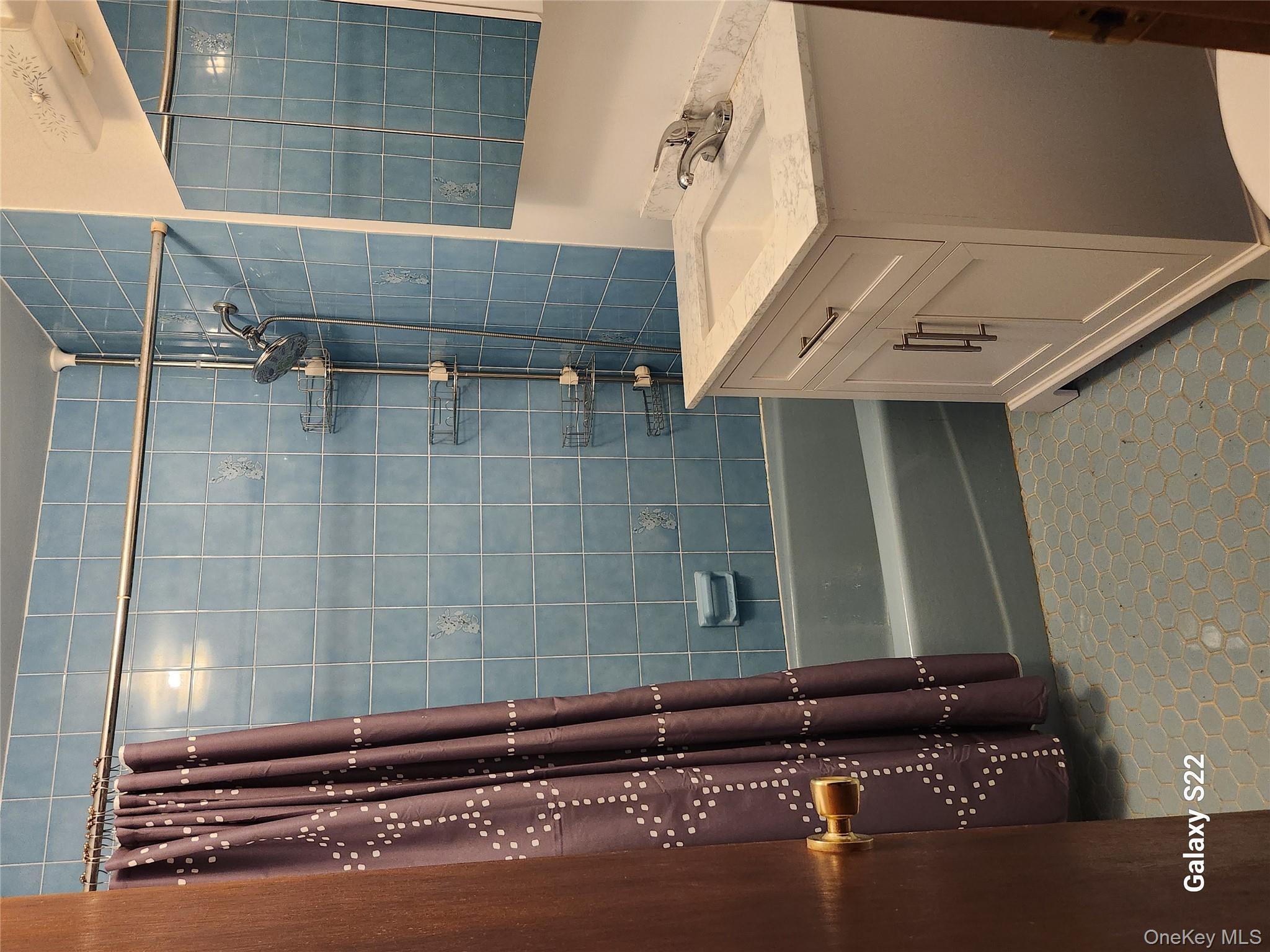 116 Croton Park Road Cortlandt Manor, NY 10567 - Photo 7 of 16 a bathroom with a sink and a mirror