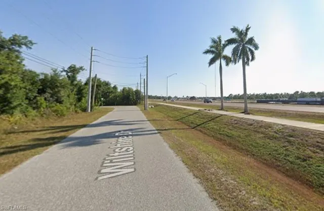 a view of an outdoor space and tennis court