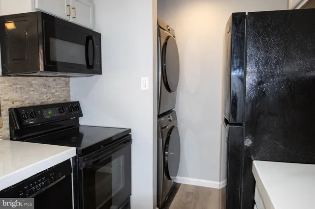 a kitchen with a sink and an oven