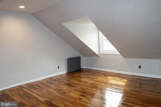 a view of room with wooden floor