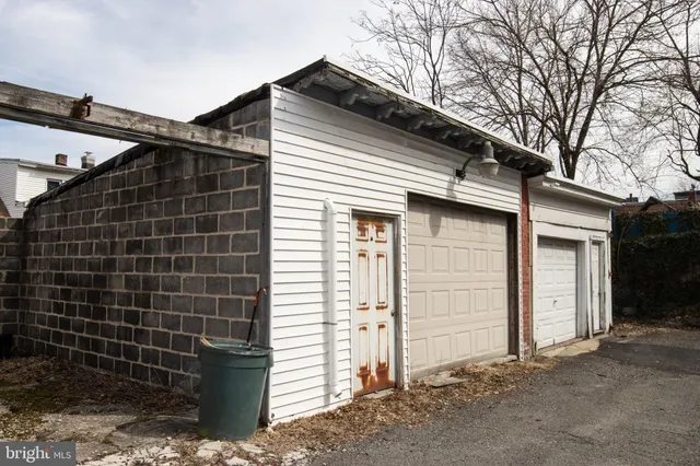 a view of a house with a door and wooden door