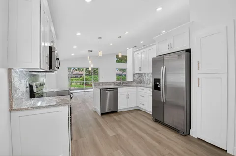 $566,000 | 5891 Royal Isles Boulevard, Boynton Beach, FL 33437