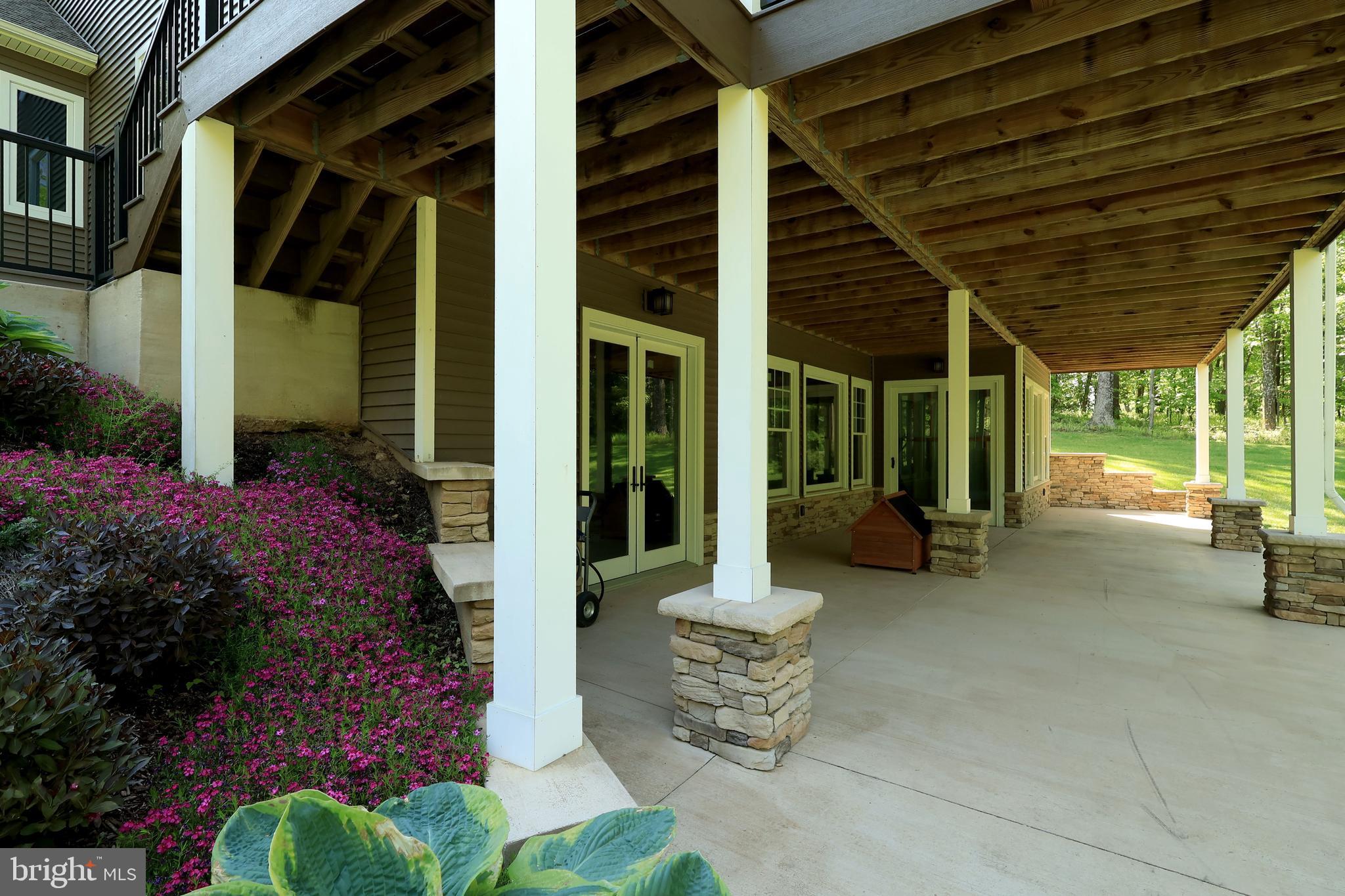 518 Two Mile Road Howard, PA 16841 - Photo 69 of 84 a view of a patio with table and chairs and potted plants
