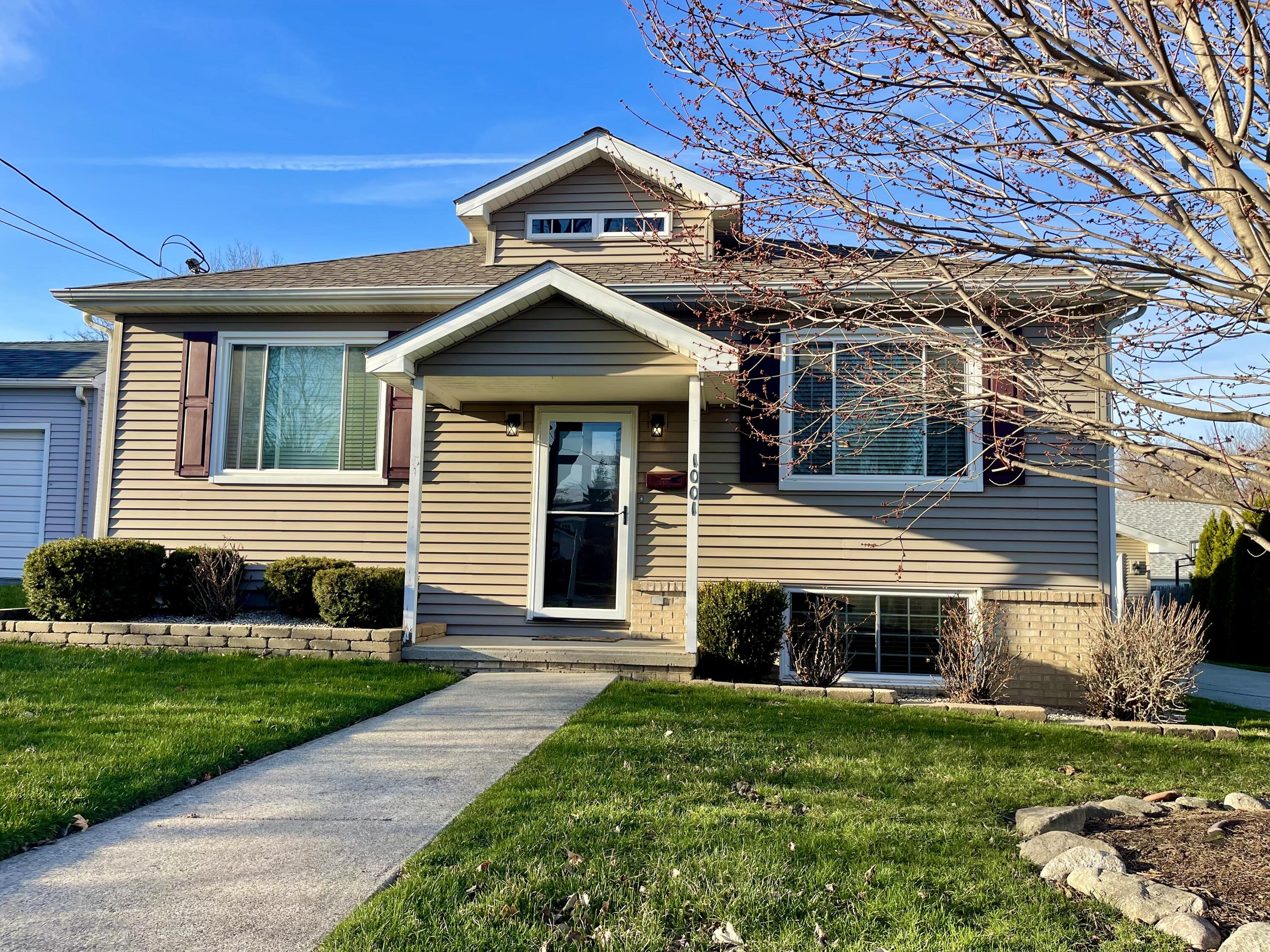 1001 Institute Street Valparaiso, IN 46383 - Photo 1 of 20 a front view of a house with a yard