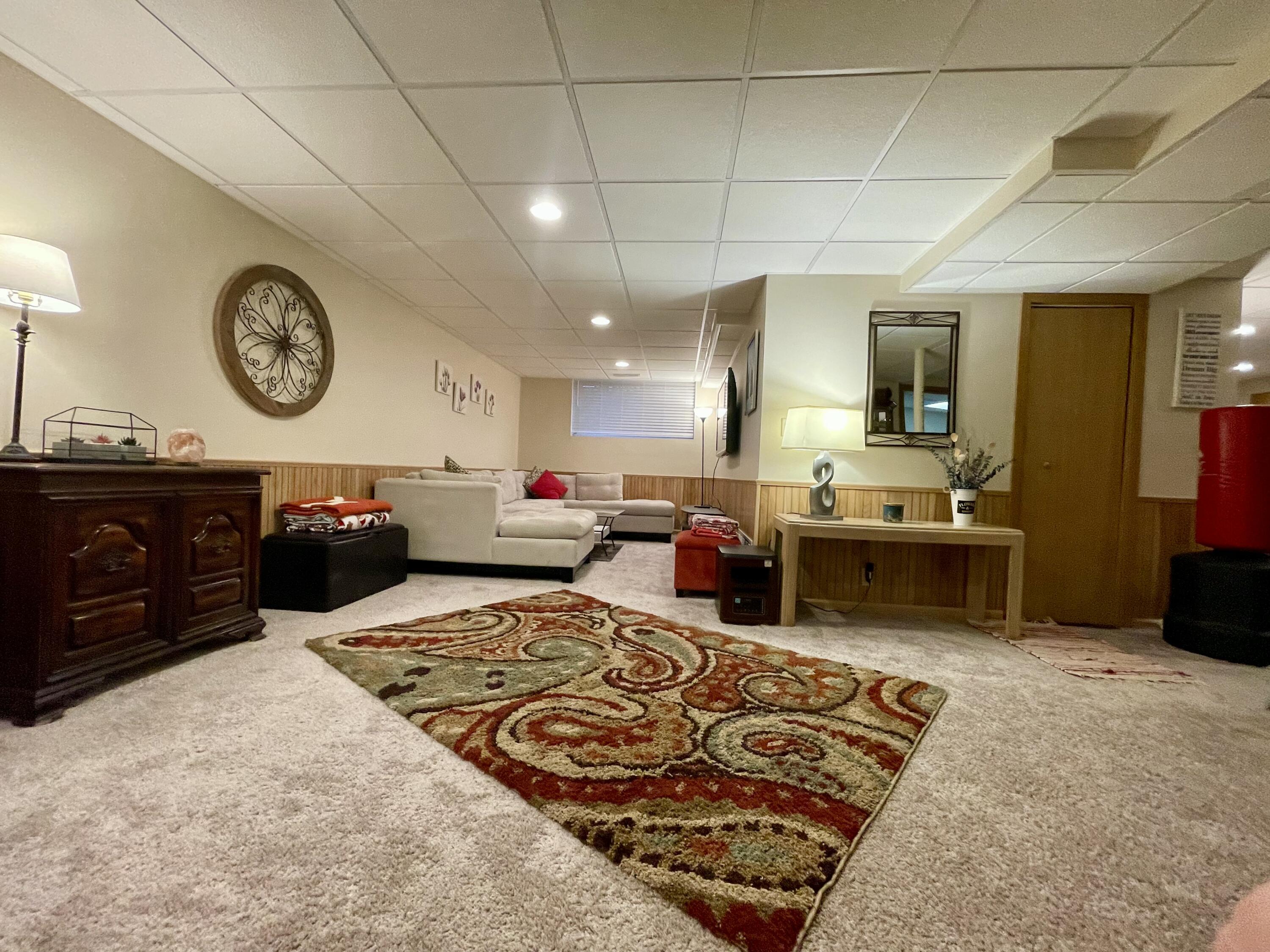 1001 Institute Street Valparaiso, IN 46383 - Photo 11 of 20 a living room with furniture and a clock