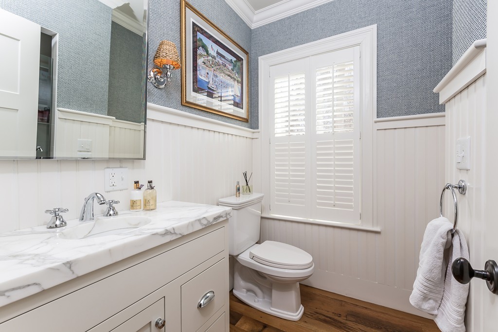 39 Middleby Road Lexington, MA 02421 - Photo 13 of 29 a bathroom with a granite countertop sink mirror vanity and toilet