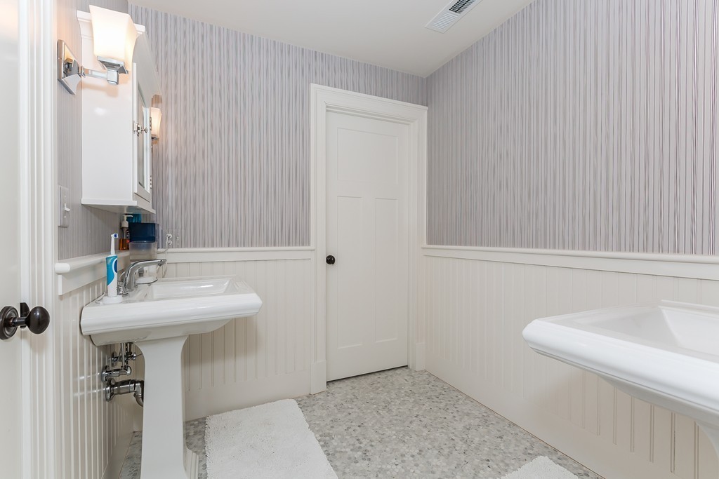 39 Middleby Road Lexington, MA 02421 - Photo 23 of 29 a bathroom with a sink a toilet and mirror