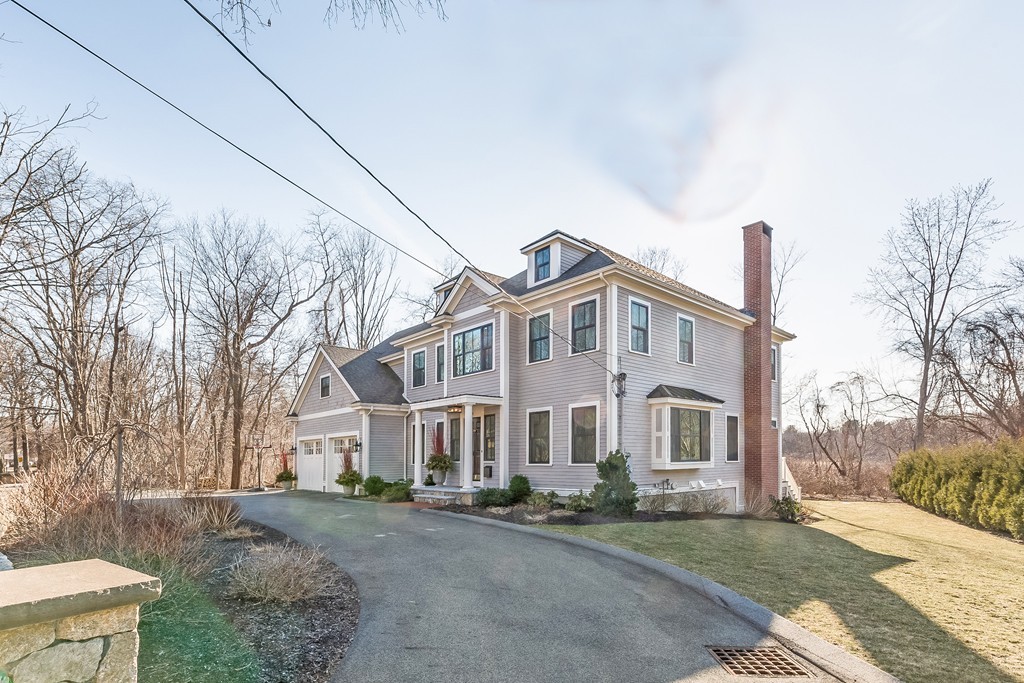 39 Middleby Road Lexington, MA 02421 - Photo 3 of 29 a view of a white house with a yard and plants