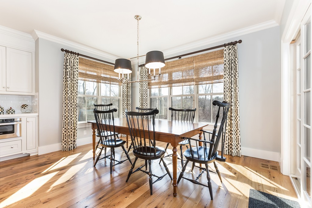 39 Middleby Road Lexington, MA 02421 - Photo 7 of 29 a view of a dining room with furniture wooden floor and a chandelier