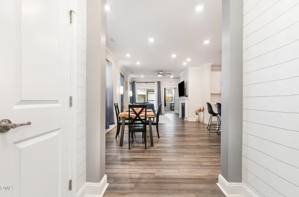 a view of a dining room with furniture and wooden floor