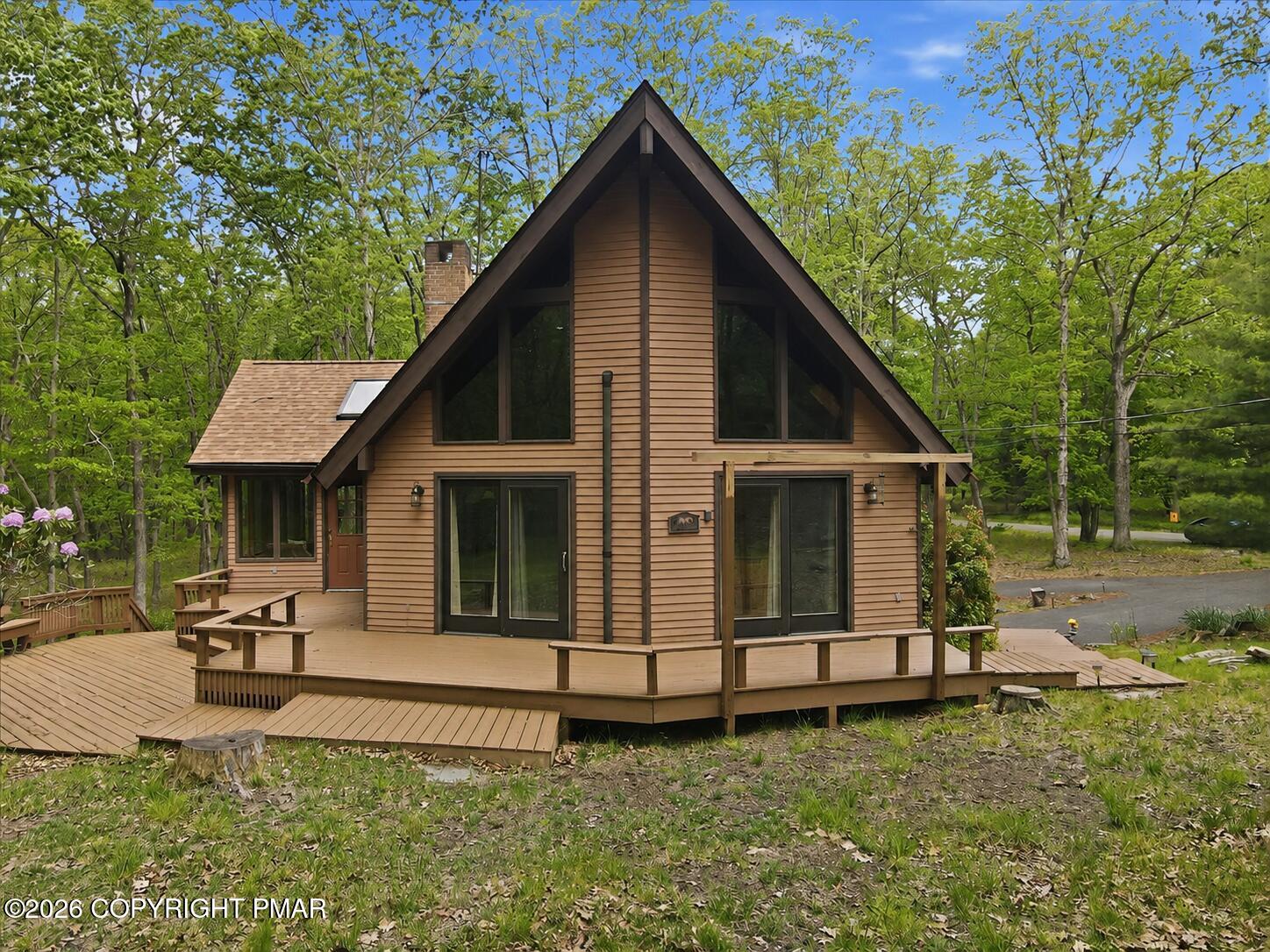 1517 Deer Run East Bushkill, PA 18324 - Photo 1 of 42 a view of a house with backyard and sitting area