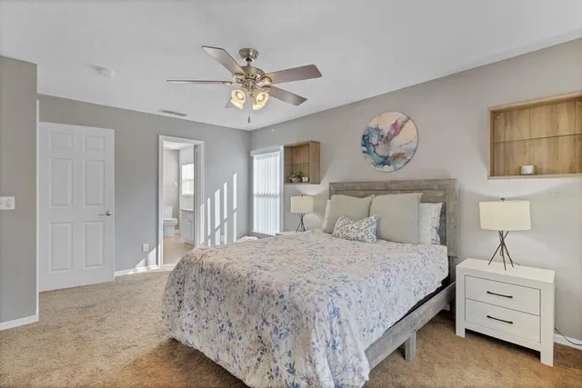 a bedroom with a bed and cabinets