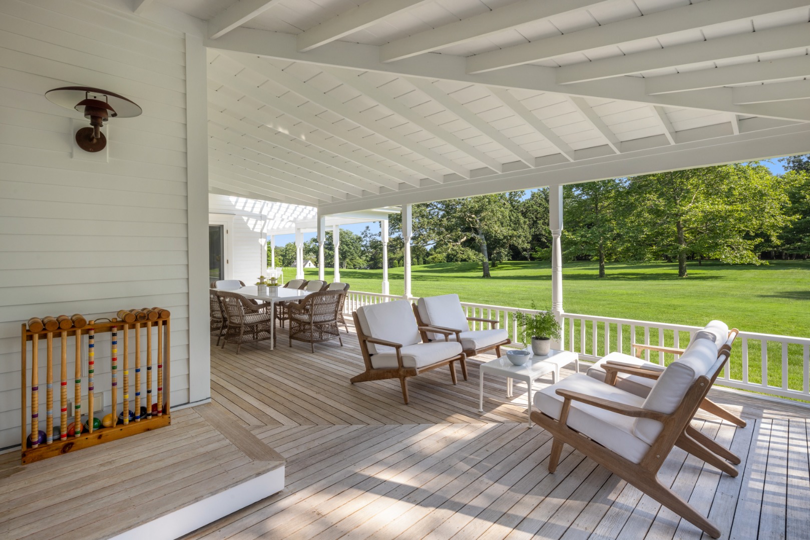 41 Cobbs Hill Road Chilmark, MA 02535 - Photo 11 of 46 a view of a patio with chairs and floor to ceiling window