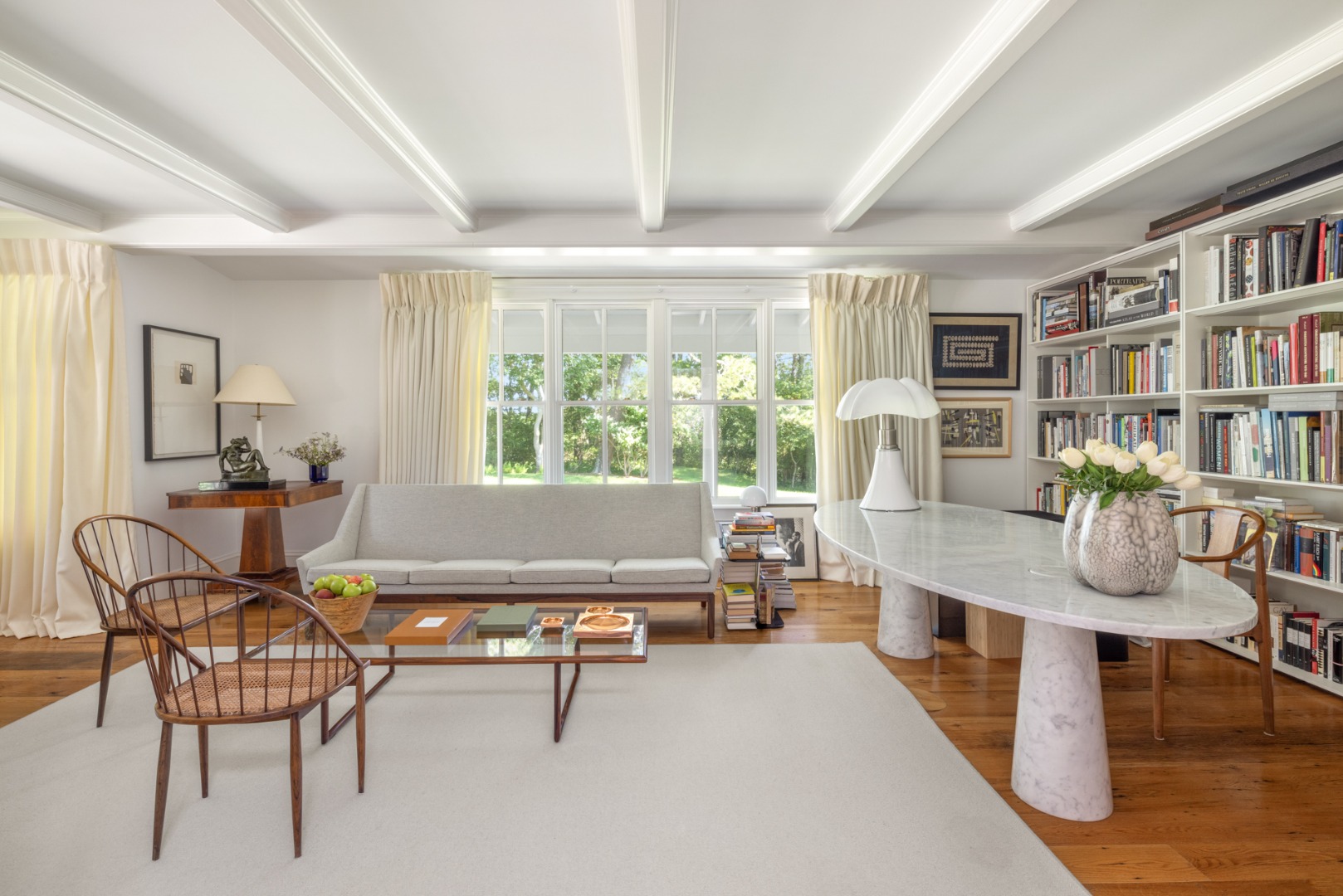 41 Cobbs Hill Road Chilmark, MA 02535 - Photo 16 of 46 a living room with furniture a bookshelf and a window