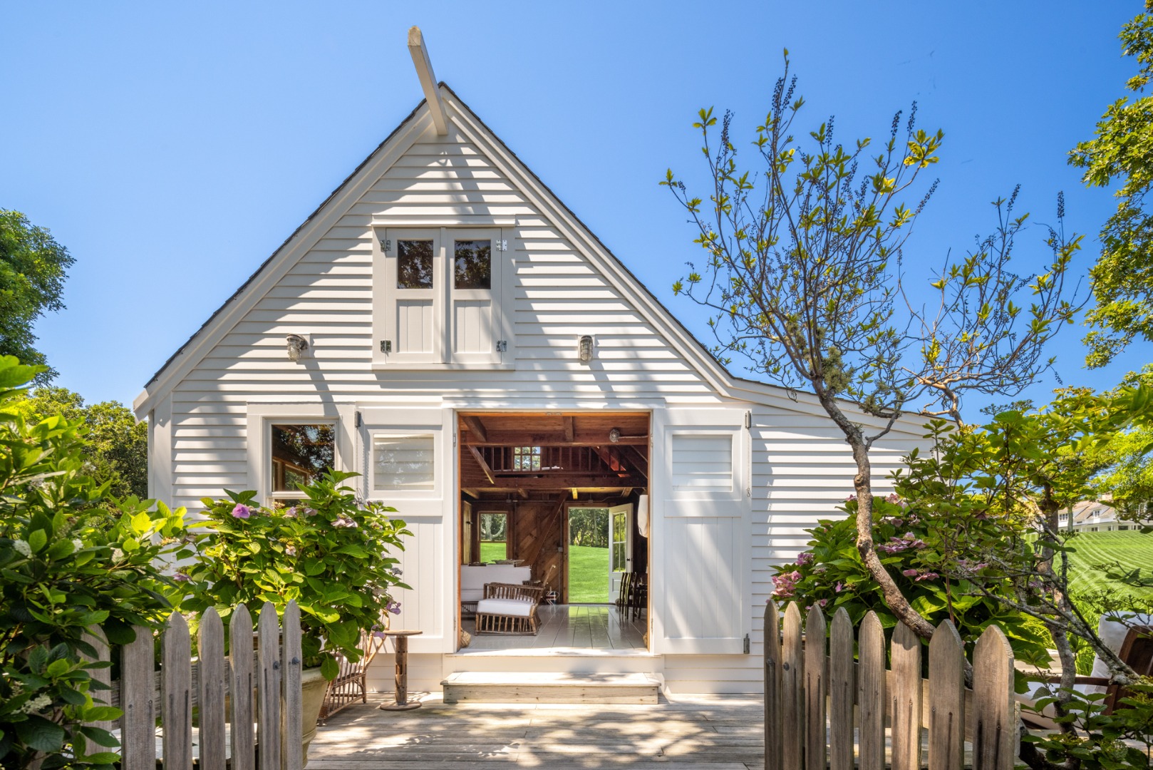 41 Cobbs Hill Road Chilmark, MA 02535 - Photo 21 of 46 a view of a house with a small yard and potted plants