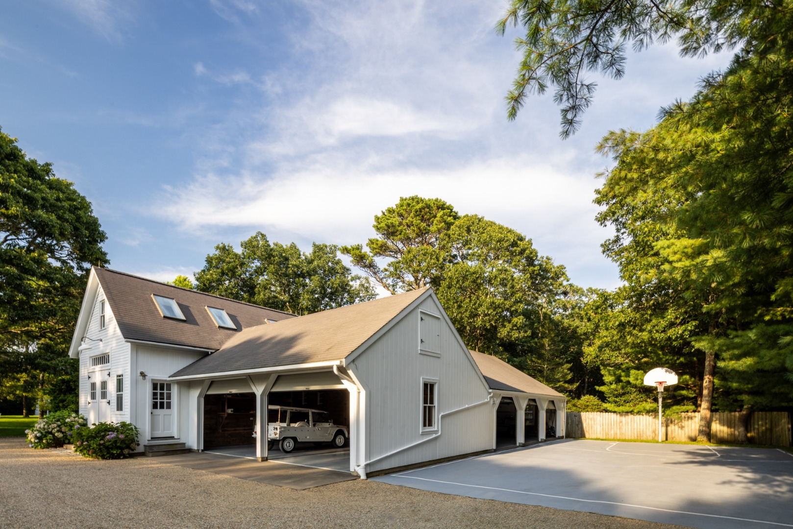 41 Cobbs Hill Road Chilmark, MA 02535 - Photo 34 of 46 a view of a white house next to a road and trees