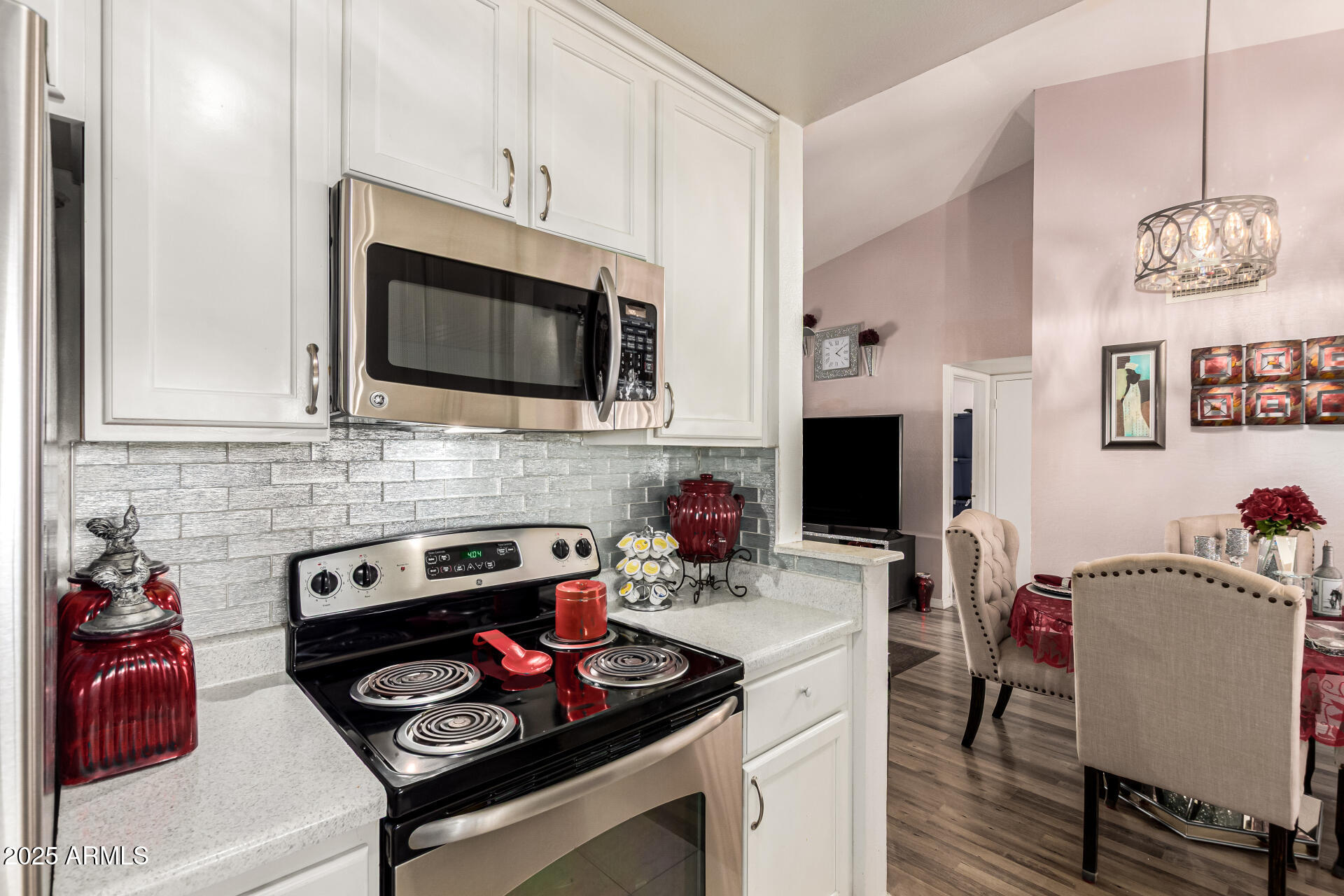 4028 East Carson Road Phoenix, AZ 85042 - Photo 11 of 26 a kitchen with a stove and a microwave