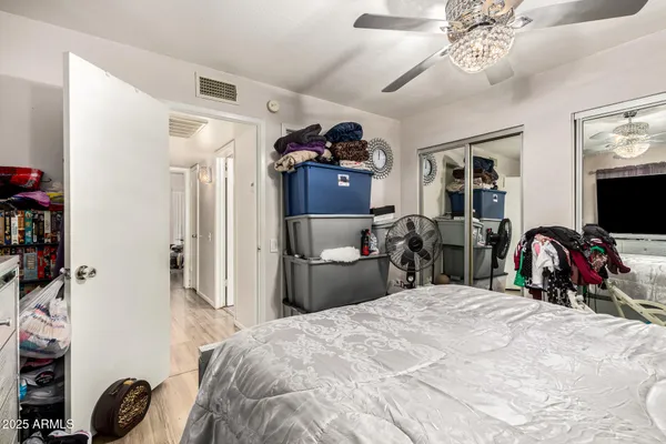 a bed room with a bed and a tv