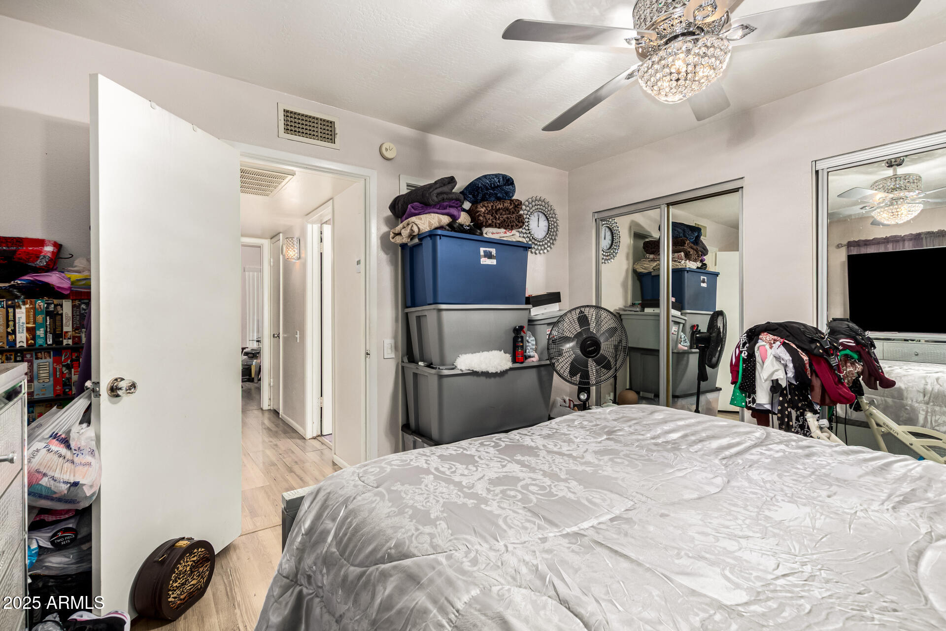 4028 East Carson Road Phoenix, AZ 85042 - Photo 17 of 26 a bed room with a bed and a tv