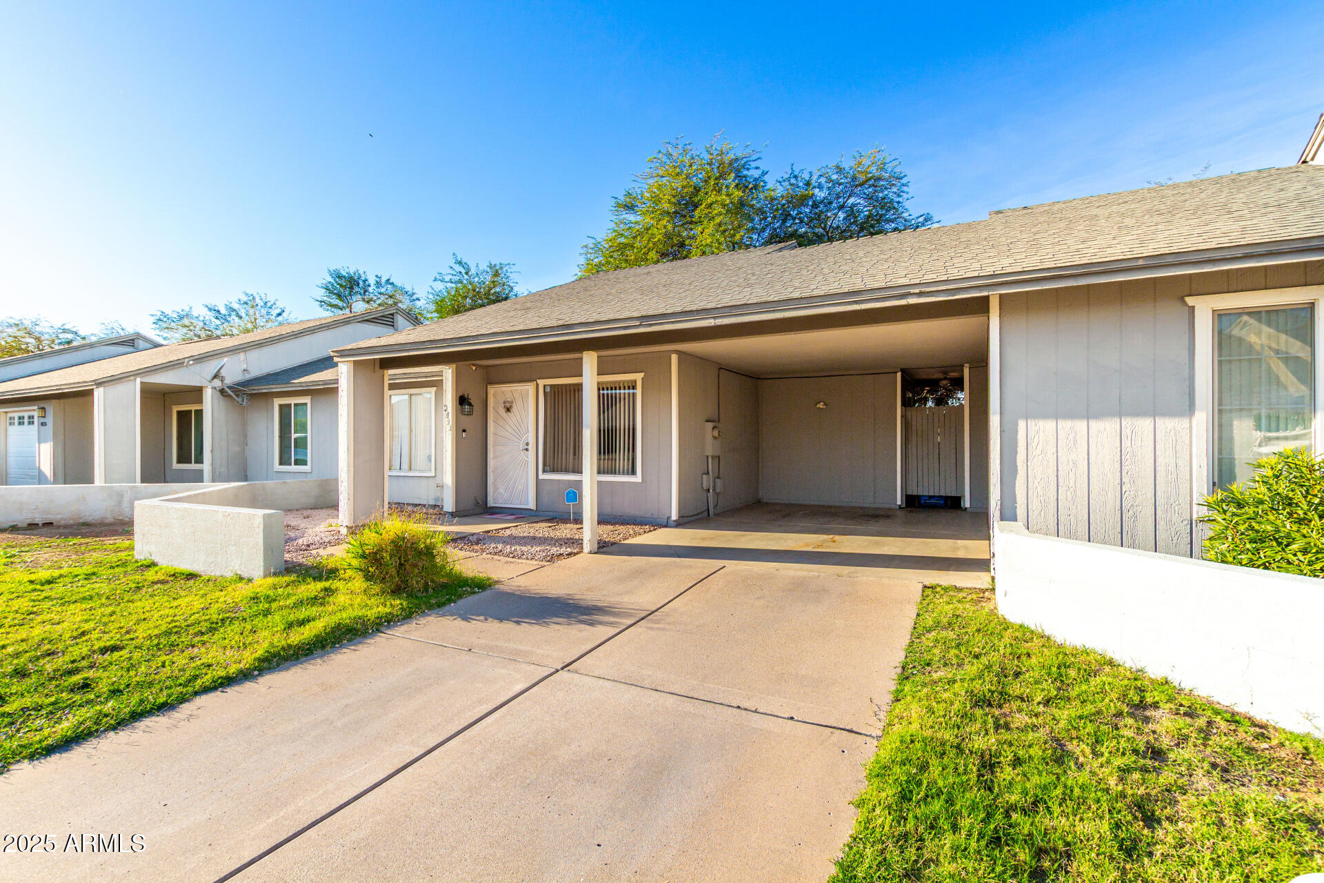 4028 East Carson Road Phoenix, AZ 85042 - Photo 2 of 26 a view of a house with a yard