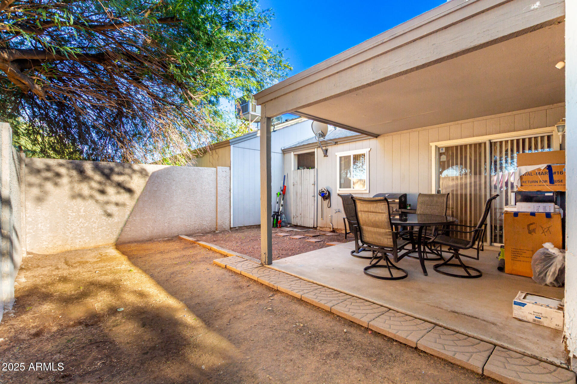 4028 East Carson Road Phoenix, AZ 85042 - Photo 25 of 26 a view of a patio with table and chairs and potted plants