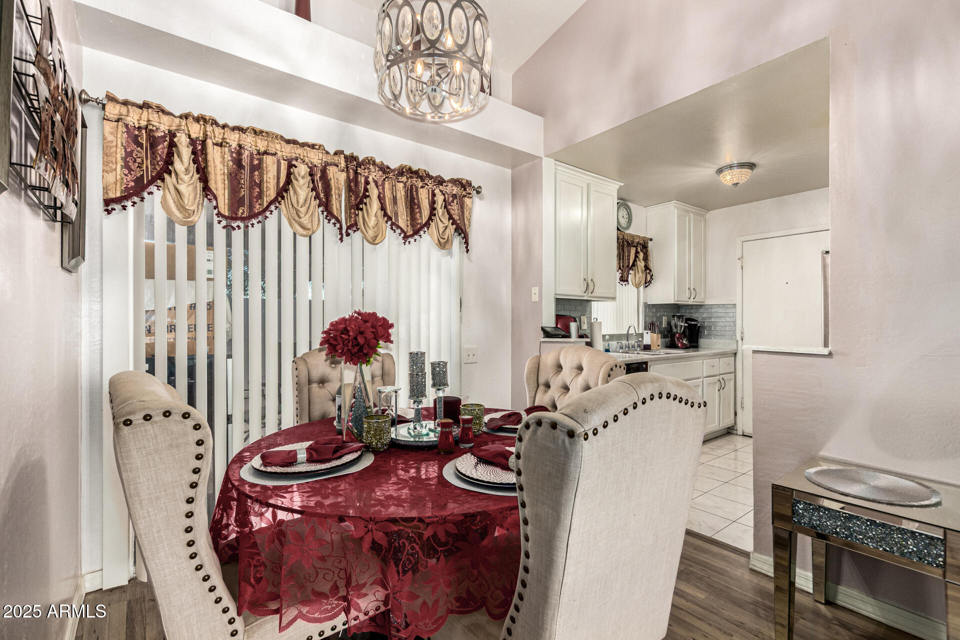 4028 East Carson Road Phoenix, AZ 85042 - Photo 8 of 26 a kitchen with stainless steel appliances granite countertop a sink and a refrigerator