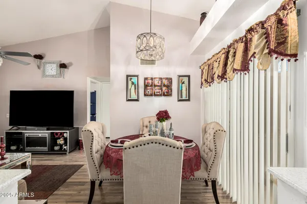 a view of a livingroom with furniture and a flat screen tv