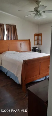 a view of a house with a glass door and wooden floor