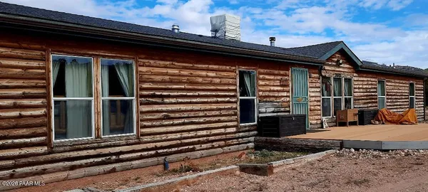 a view of a backyard of the house