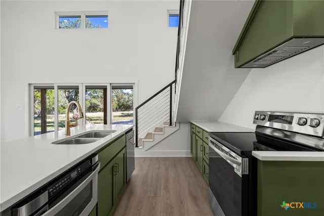 a kitchen with a sink and stove