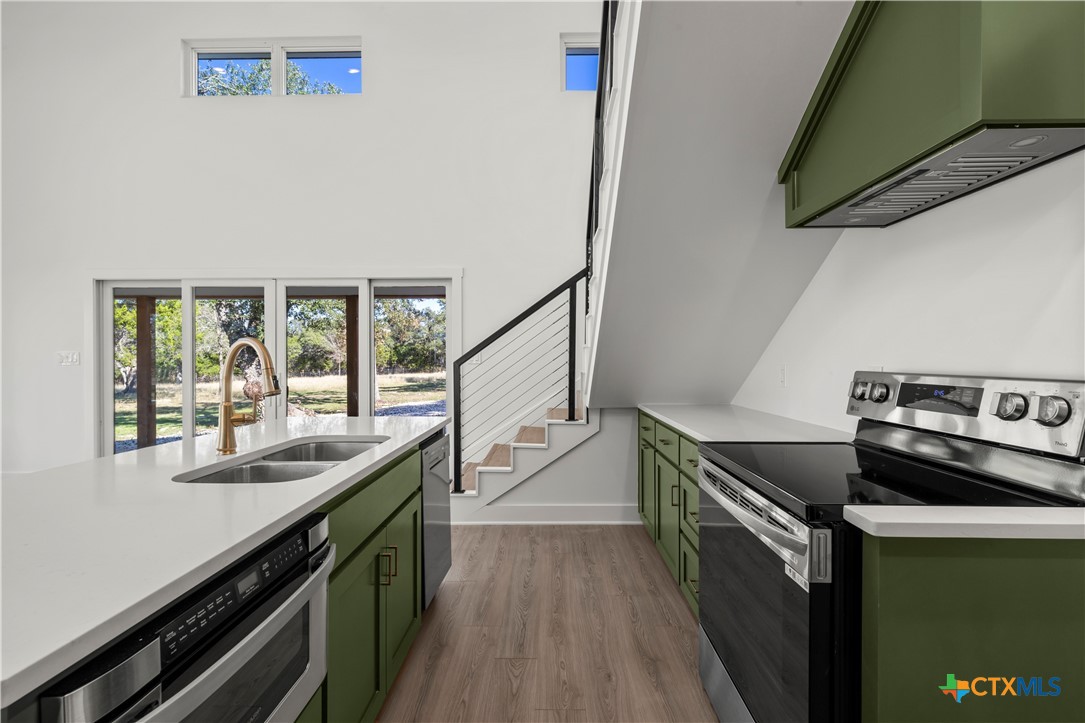 7660 McGregor Park Road Temple, TX 76502 - Photo 27 of 47 a kitchen with a sink and stove