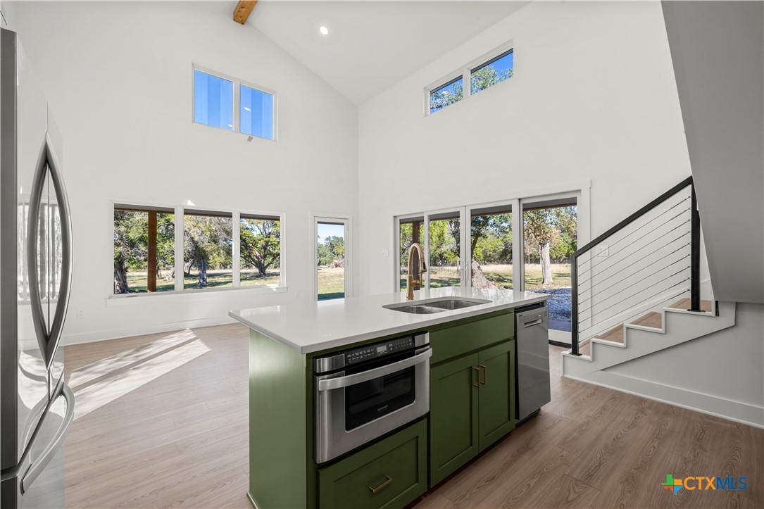 7660 McGregor Park Road Temple, TX 76502 - Photo 28 of 47 a kitchen with a stove and a large window