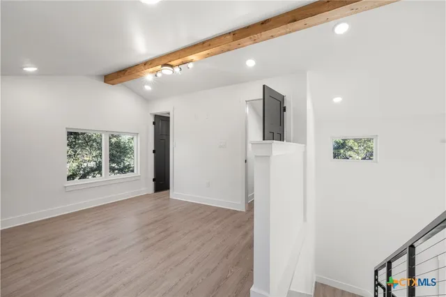 a view of livingroom with hardwood floor and hallway