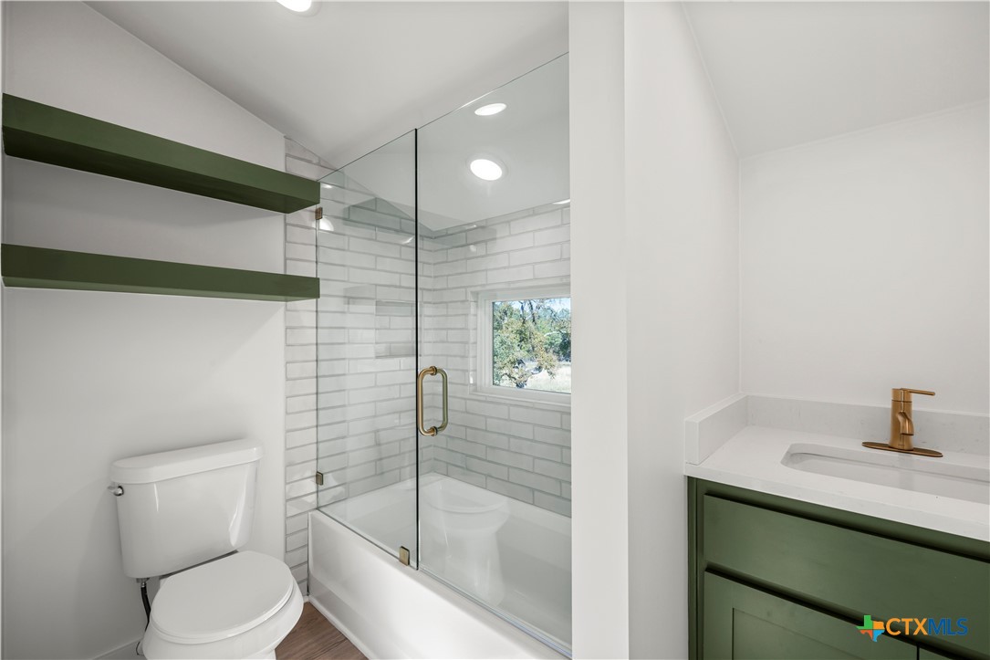 7660 McGregor Park Road Temple, TX 76502 - Photo 35 of 47 a bathroom with a sink a toilet and shower