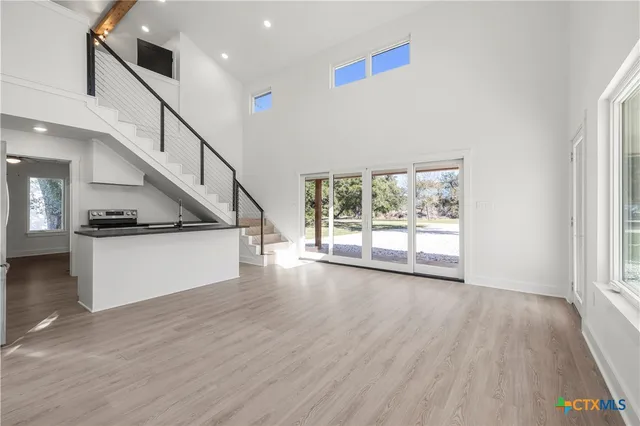 a view of an entryway with wooden floor
