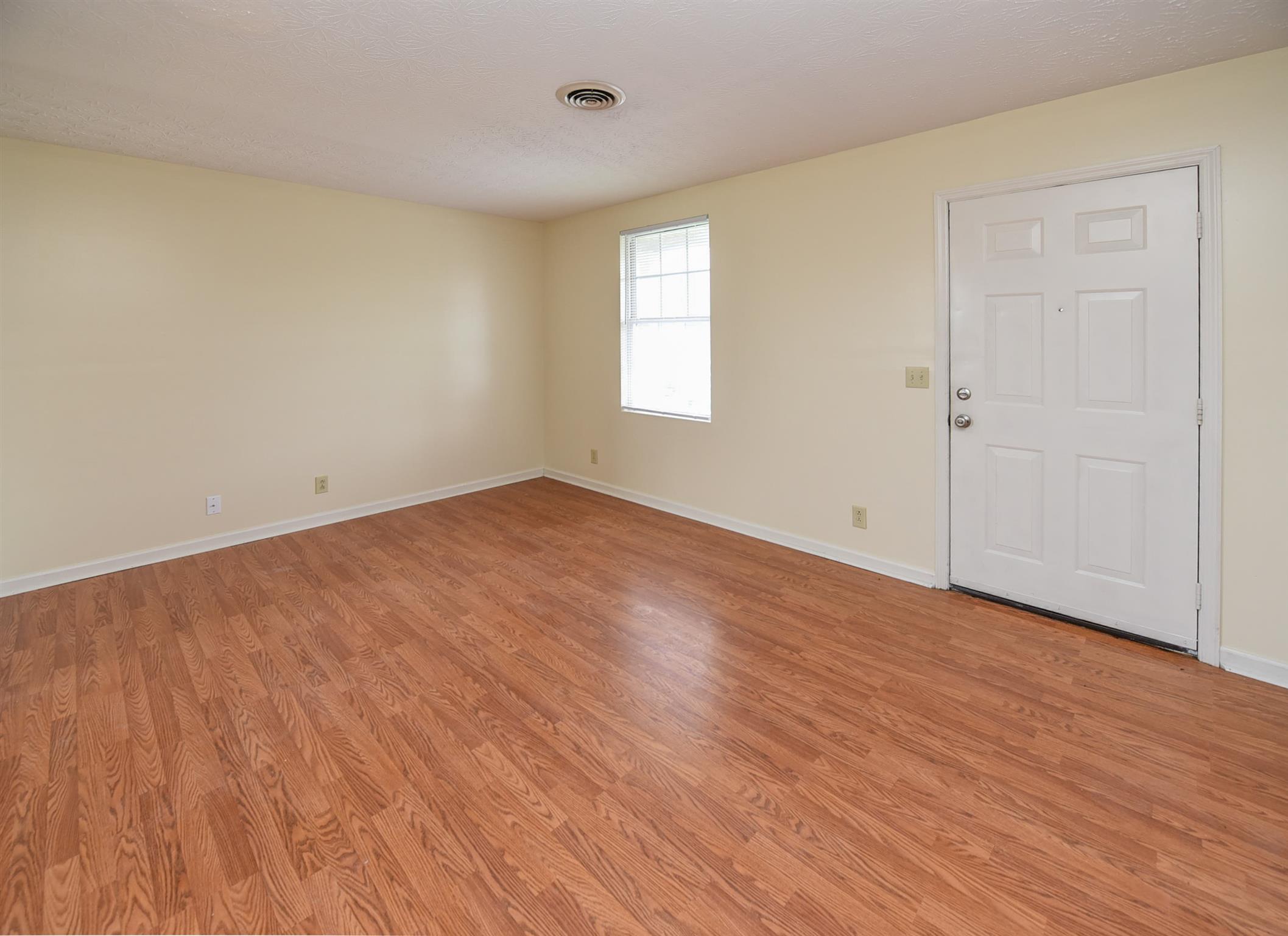 2000 R W Gordon Drive Springfield, TN 37172 - Photo 10 of 21 a view of an empty room with wooden floor and a window