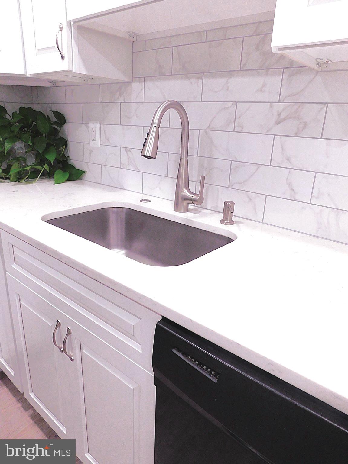 2241 Cartwright Place Reston, VA 20191 - Photo 17 of 40 SS sink, pull-down faucet, soap & disposal control