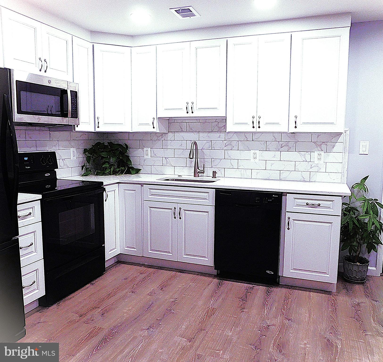 2241 Cartwright Place Reston, VA 20191 - Photo 18 of 40 Open kitchen is pro-designed to maximize space