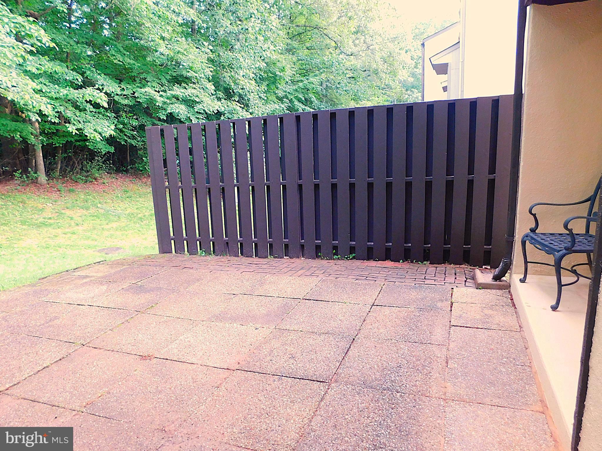 2241 Cartwright Place Reston, VA 20191 - Photo 34 of 40 Concrete patio with newer privacy fence (2025)