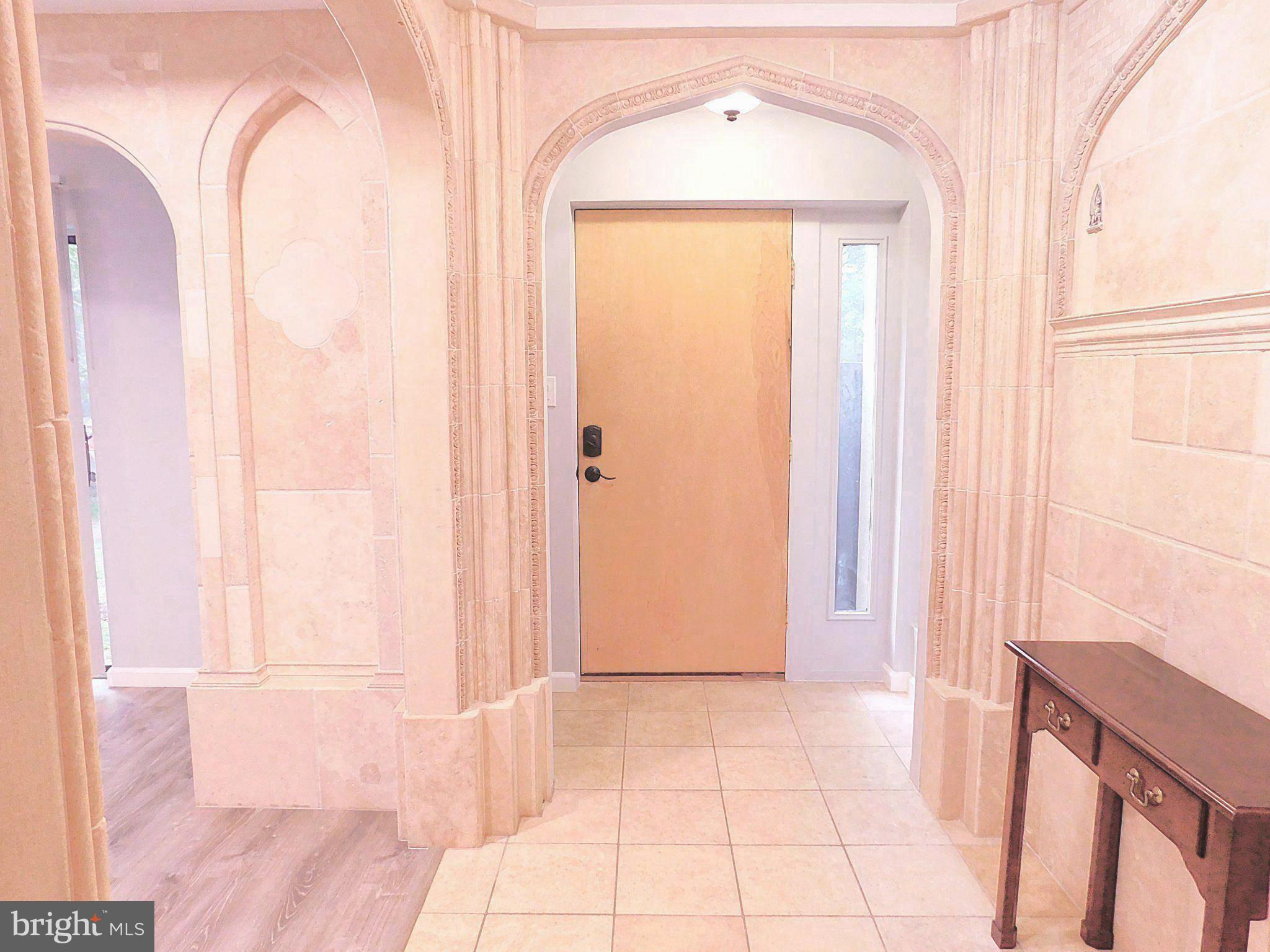 2241 Cartwright Place Reston, VA 20191 - Photo 5 of 40 Elegant, Travertine sand colored stone in Foyer