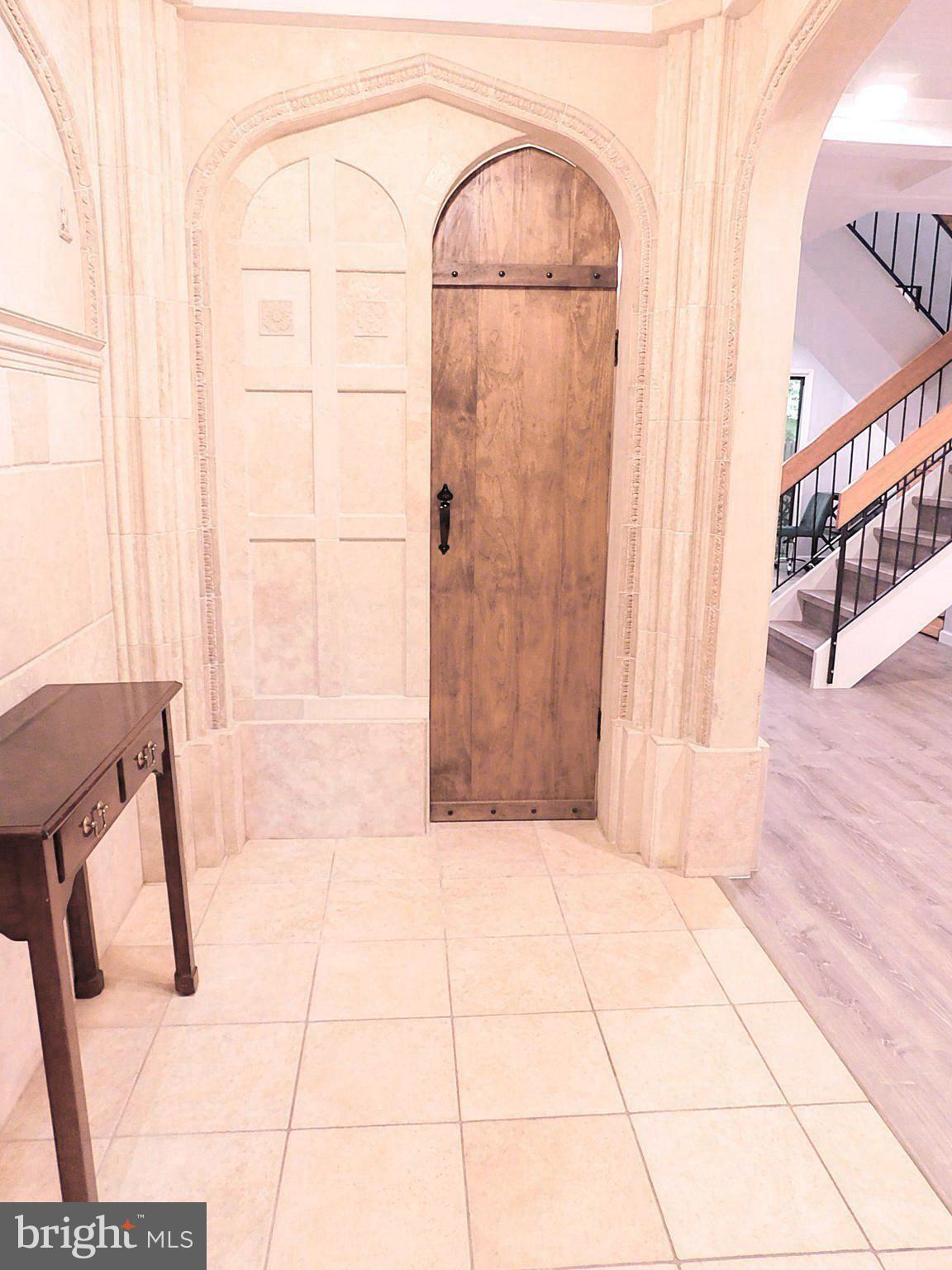 2241 Cartwright Place Reston, VA 20191 - Photo 6 of 40 Powder Room door is replicated in stone at left